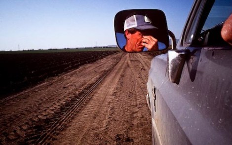 A farmer wipes his eyes after driving through dry fields in near the town of Huron in California's San Joaquin Valley. Photo by Scott Anger via Creative Commons, all rights reserved.